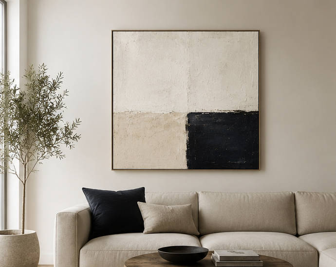 Modern living room with minimalist decor and abstract wall art.